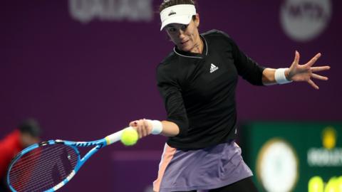 Garbine Muguruza hits a forehand