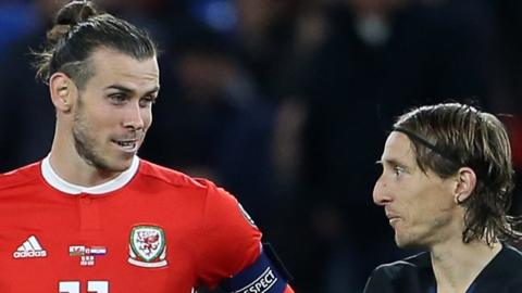 Gareth Bale and Luka Modric talk to each other during Wales v Croatia