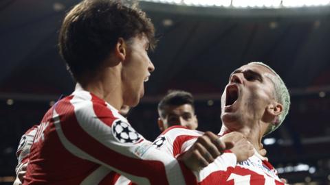 Atletico Madrid's Antoine Griezmann celebrates scoring their second goal with Joao Felix against Porto in the Champions League