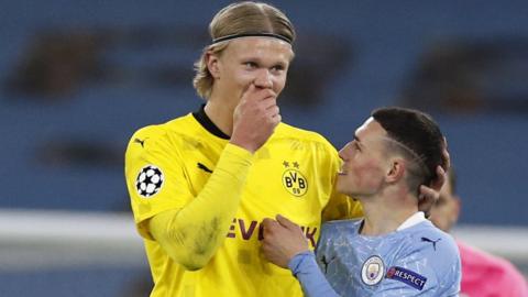 Erling Haaland and Phil Foden chat after the Champions League first leg