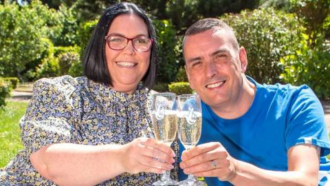 Louise and Stuart Tate toast the win with a glass of bubbly