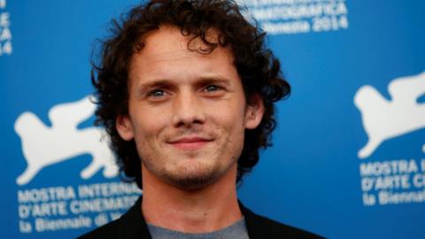 Anton Yelchin poses during the photo call for the film Burying the ex at the 71st Venice Film Festival 4 September, 2014