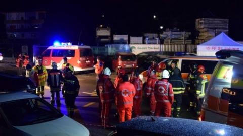 Emergency workers attend the scene in Luttach