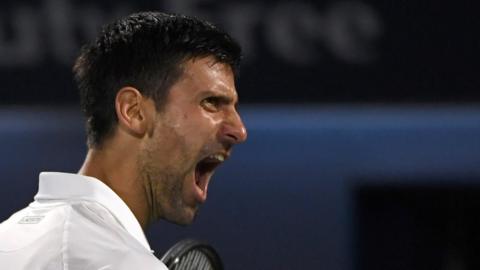 Novak Djokovic celebrates winning in Dubai