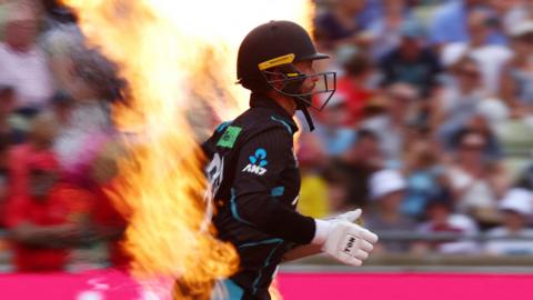 Devon Conway emerges through flames