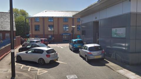 Cars parked outside Wrexham Shopmobility