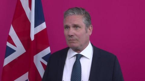 Sir Keir Starmer infront of Union Jack flag