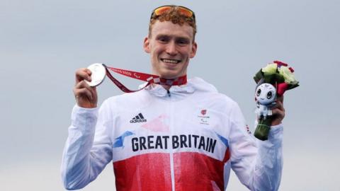 George Peasgood on the podium at the Tokyo 2020 Paralympics after winning Para-triathlon silver
