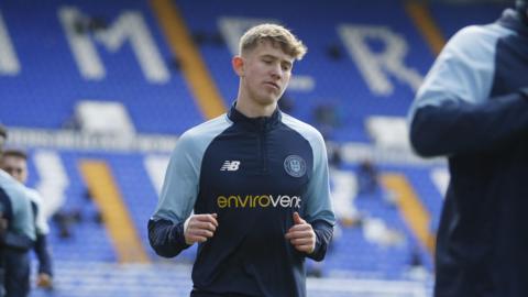 A photo of Jack Bray warming up before a match
