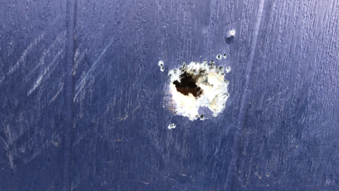 Bullet hole in door