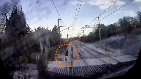 A man came within feet of being hit by a high-speed train.