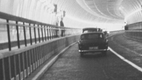 A car travels through the Clyde Tunnel in Glasgow in 1963
