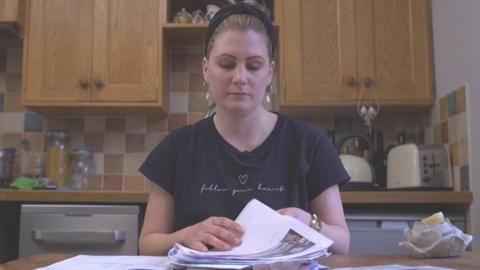 Hannah Bishop examines paperwork in fight against UKCPM
