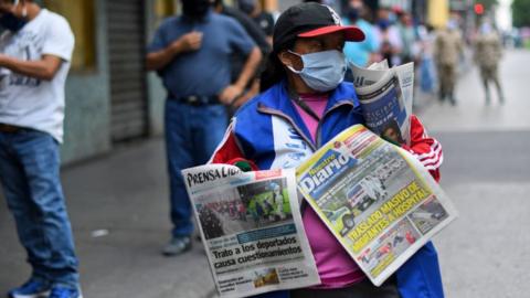 A street seller selling newspapers in Guatemala City on April 16, 2020