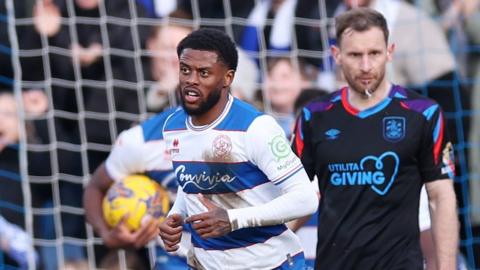 Kenneth Paal celebrates scoring QPR's late equaliser against Huddersfield