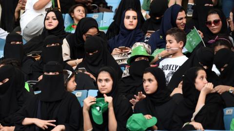 Saudi women sit in a stadium to attend an event in the capital Riyadh on 23 September 2017 commemorating the anniversary of the founding of the kingdom