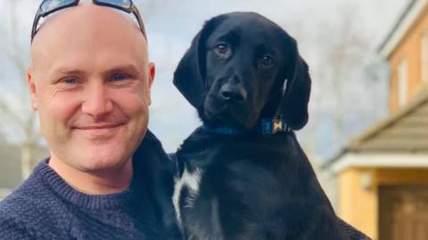 PC Simon Shaughnessy with puppy Reggie