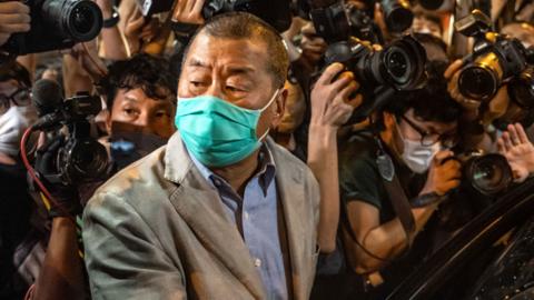 Hong Kong pro-democracy media tycoon Jimmy Lai leaves Mong Kok police station after being released on bail on 12 August 2020 in Hong Kong, China