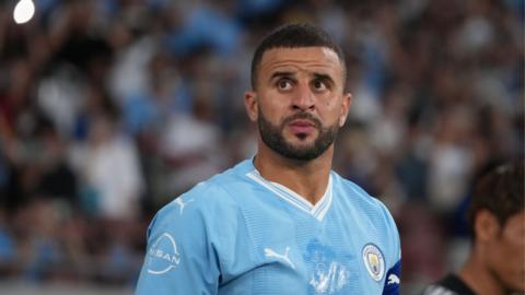 Kyle Walker wearing a Manchester City shirt