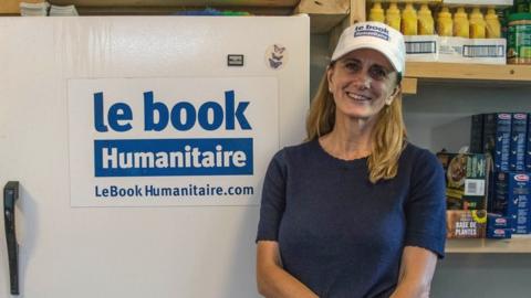 Portrait of Rachel Lapierre in Le Book Humanitaire’s office. Behind her, a fridge and food that she keeps for people in need.