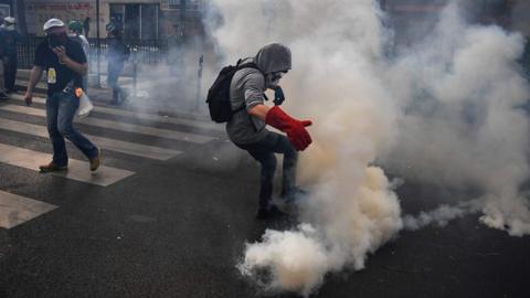 Man amid tear gas in Paris