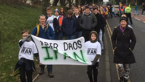 300 people take part in a walk to support the family of Ifan Owens