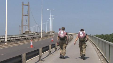 Soldiers walking across Humber Bridge