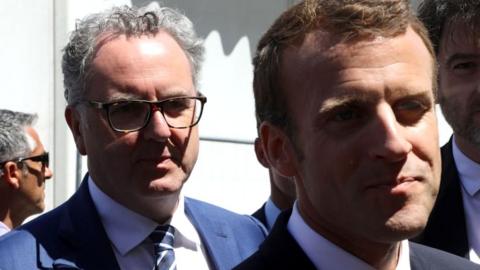 French President Emmanuel Macron (R) and president of the French National Assembly Richard Ferrand arrive