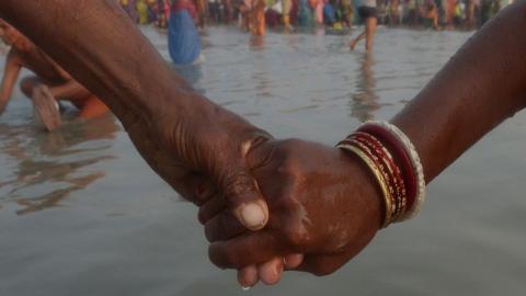 A representational photo of a couple holding hands.