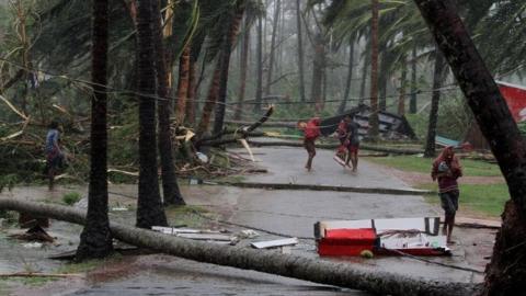 People seek shelter during the cyclone