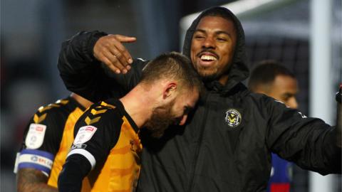 Brandon Cooper (6) of Newport celebrates his match-winning goal with Tristan Abrahams