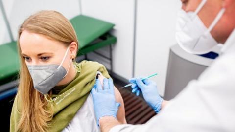 A woman receiving the vaccine in Germany