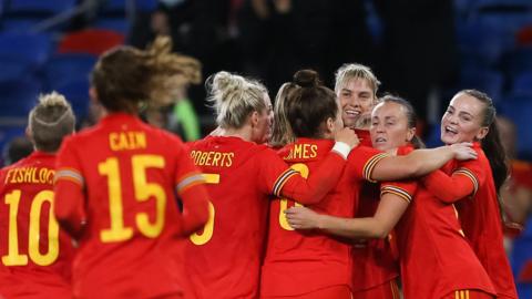 Wales celebrate a goal against Estonia in 2021