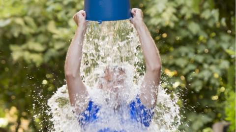 Pouring a bucket of cold water over his head