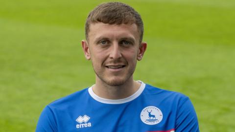 Oliver Finney in a hartlepool shirt