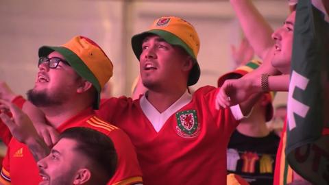 Wales fans in a pub watching the World cup