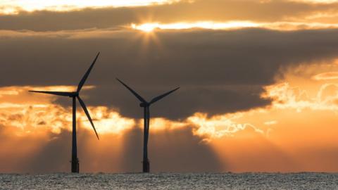 Offshore turbines in Norfolk at sunrise