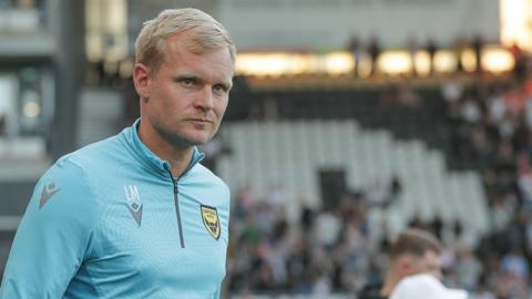 Oxford United boss Liam Manning on the touchline for the U's during a League One game.