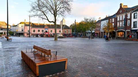 A bench seat in the market square which has been spruced up
