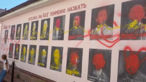 Paintings of Stalin's victims defaced