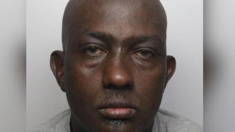 A mugshot of Haybe Cabdiraxmaan Nur