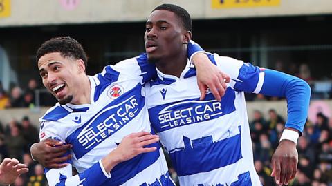 Reading players celebrate after their equaliser against Oxford United