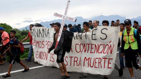 Migrants take part in a caravan towards the border with the United States in Huehuetan, Chiapas State, Mexico, on November 1, 2023.