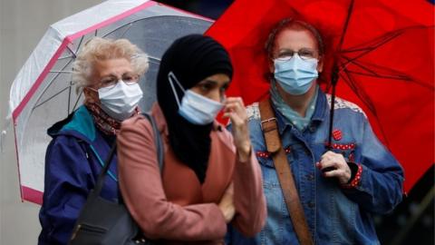 Woman in masks in Blackburn