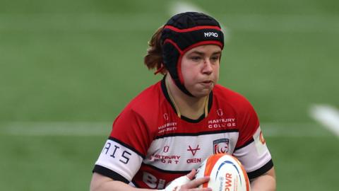 Bethan Lewis runs with the ball during a Gloucester-Hartpury game