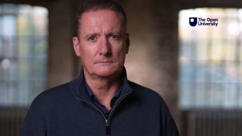 Fomer prison officer looking directly at the camera