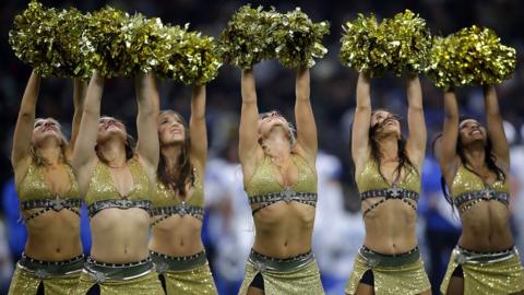 Cheerleaders perform during a game between the New Orleans Saints and the Detroit Lions at the Mercedes-Benz Superdome.