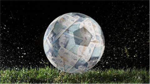 A football appearing to be made of £5 notes wrapped around