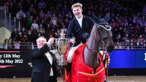 Harry Charles lifting last years trophy