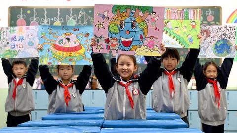 Pupils showcase 'World Earth Day' themed poster in Handan City, Hebei Province, China on April 21, 2025.